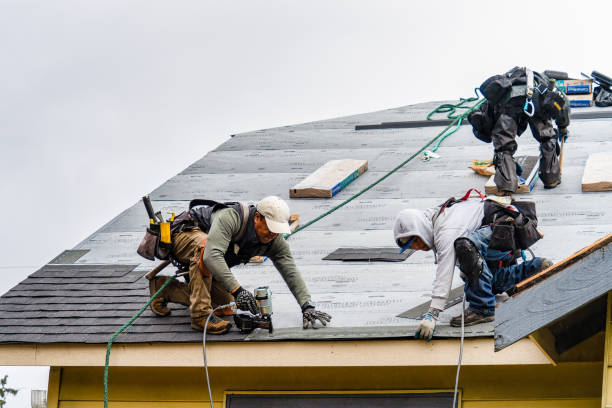 Professional Roofing technician working in Elberon, VA